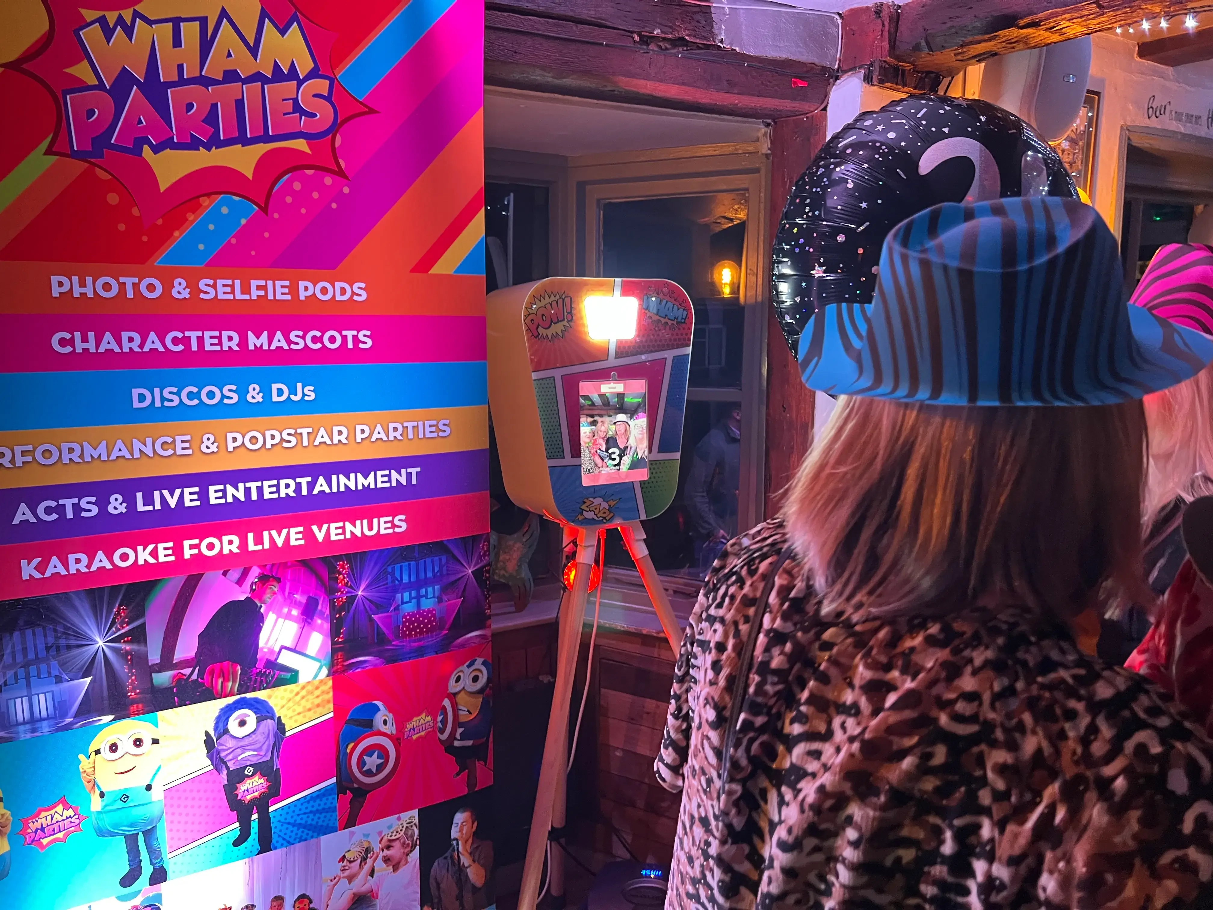 A guest using the WHAM Selfie Pod at a party